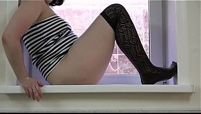 Hairy pussy with sex toy masturbates on the windowsill to a very wet orgasm. Amateur fetish and foot fetish.
