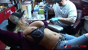 Shyla Stylez gets tattooed while playing with her tits